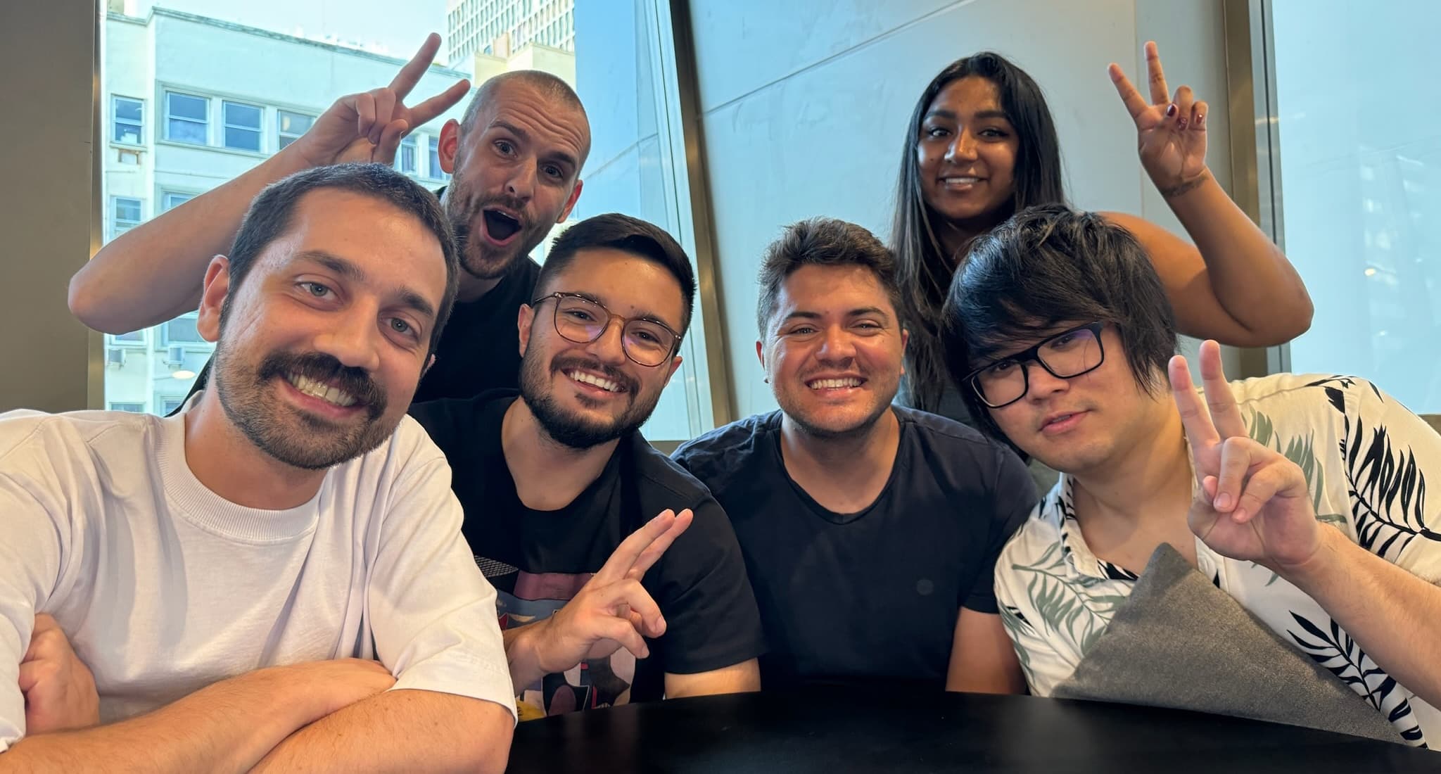 A picture of the Resend team, 6 people smiling to the camera in an office-like setting